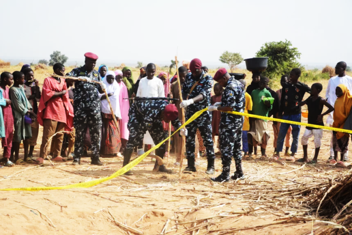 Nigeria Bomb Strike Nigeria police, Anti-Bomb squad, secure the scene of a U.S. airstrike in Northwest, Jabo, Nigeria