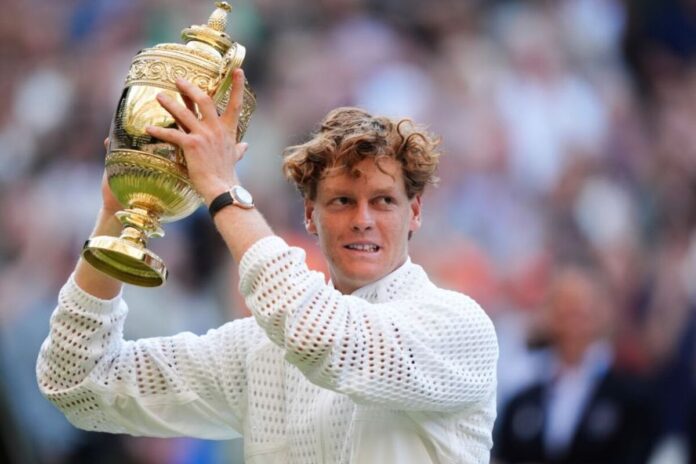 Jannik Sinners holding his Wimbledon title Jannik Sinner holding his Wimbledon title
