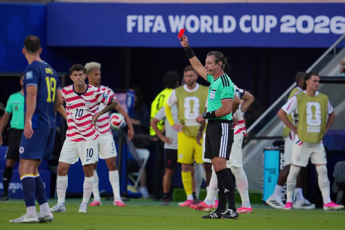 FIFA Red Card Reversal: Trump Defends Folarin Balogun as World Cup Decision Sparks Global Debate 1 Referee Raphael Claus of Brazil shows the red card to United States' Folarin Balogun