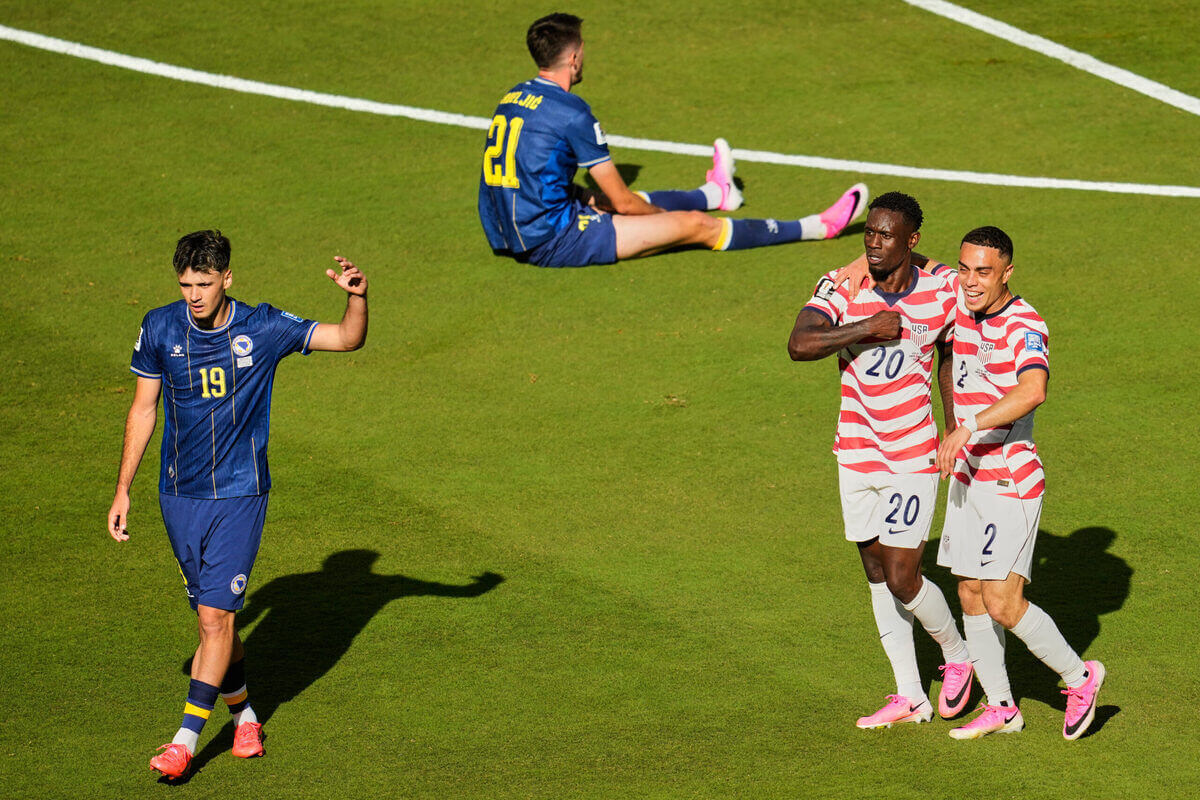 USA Advances to the World Cup Round of 16 with a Win Against Bosnia 1 USA team in action against Bosnia during their World Cup game
